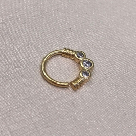 PIERCING ILUMINAR BANHADO A OURO