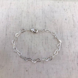 PULSEIRA CORAÇÃO VAZADO INFANTIL BANHADO A PRATA