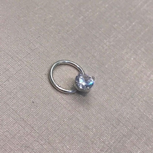 PIERCING PONTO DE LUZ BANHADO A PRATA