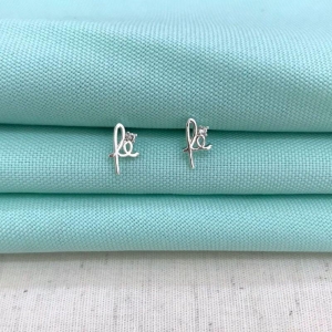 BRINCO FÉ ZIRCÔNIA BANHADO A PRATA