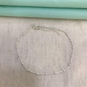 TORNOZELEIRA ESFERAS BANHADO A PRATA