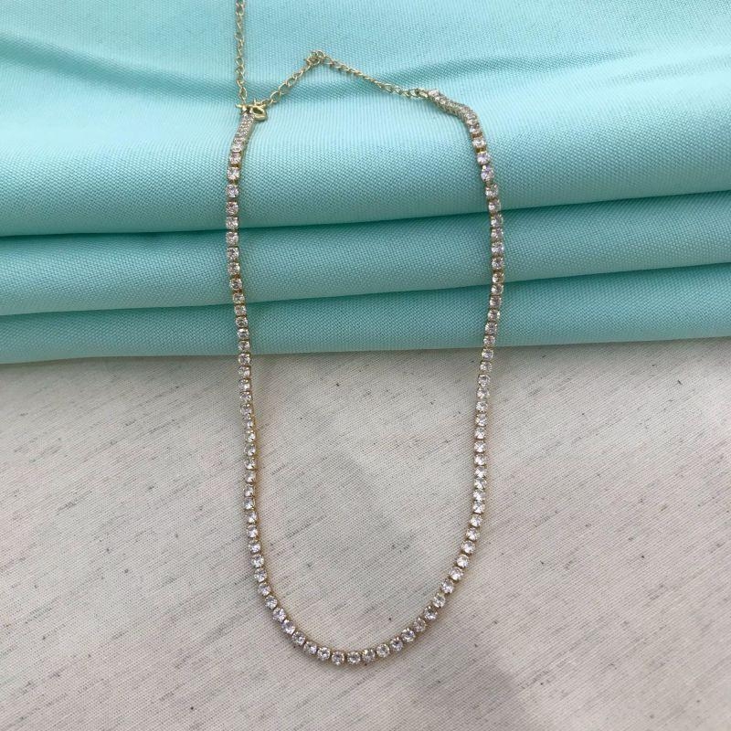 RIVIERA CRAVEJADA EM ZIRCÔNIA BANHADO A OURO