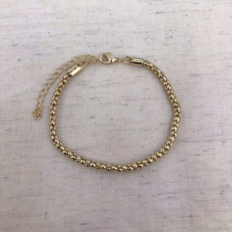 PULSEIRA MALHA CORRENTARIA BANHADO A OURO
