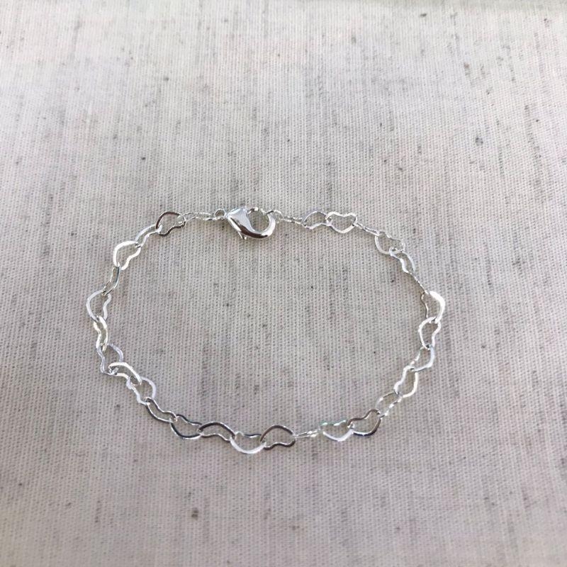 PULSEIRA CORAÇÃO VAZADO INFANTIL BANHADO A PRATA