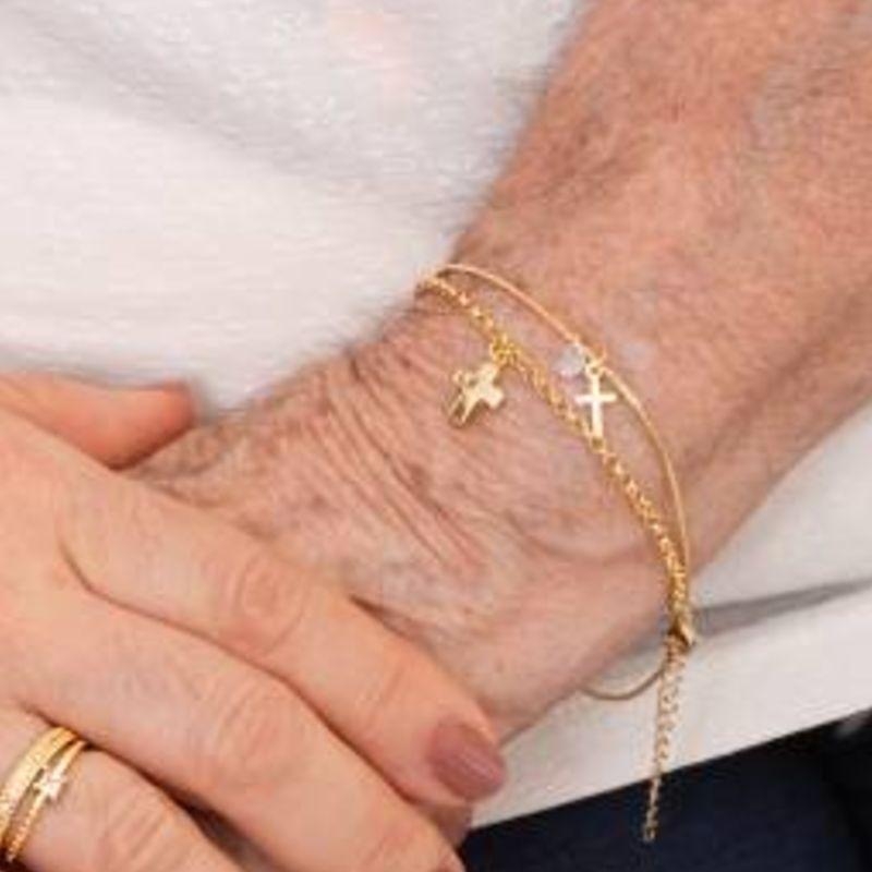 PULSEIRA CRUZ LUZ BANHADO A OURO