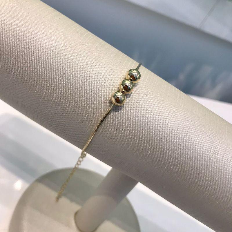 PULSEIRA TRIO DE ESFERAS BANHADO A OURO