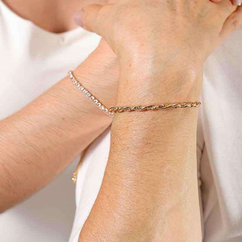 BRACELETE ENTRELAÇADO DIAMANTADO BANHADO A OURO