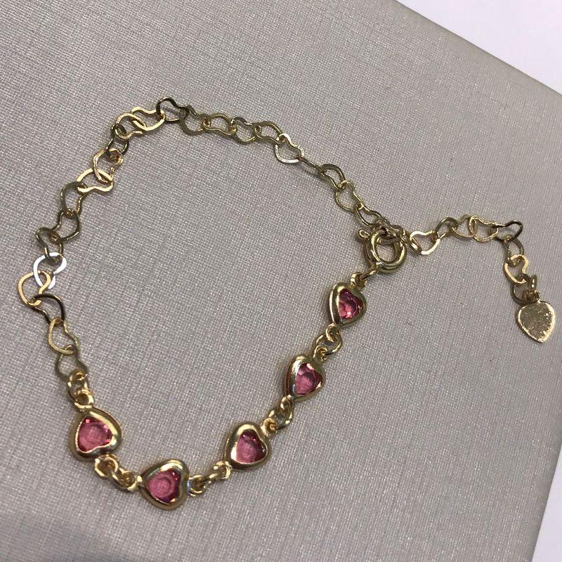 PULSEIRA CORAÇÃO VAZADO ROSA INFANTIL BANHADO A OURO