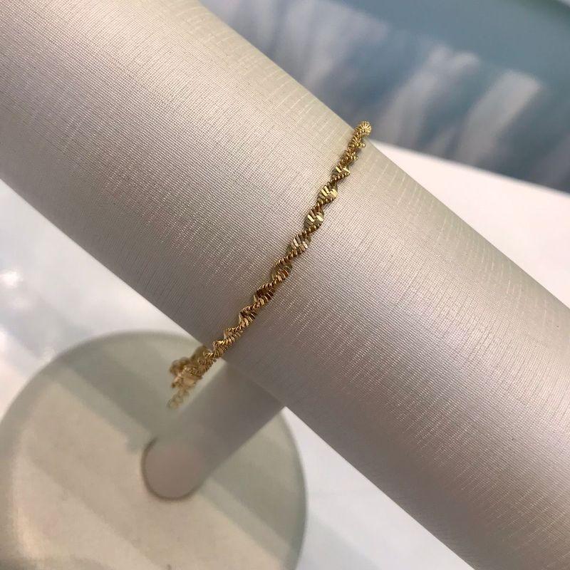 PULSEIRA TORCIDA DIAMANTADA BANHADO A OURO