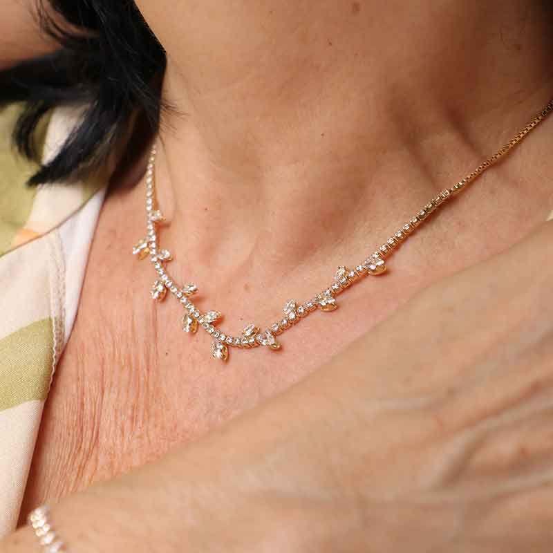 RIVIERA FOLHAS CRAVEJADA EM ZIRCÔNIA BANHADO A OURO